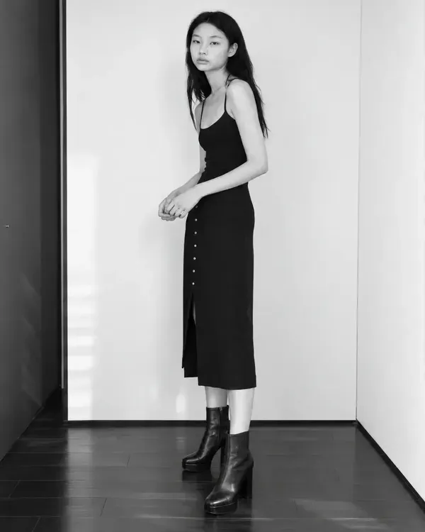 Three black and white photos of a model in a black dress (full length, close-up and half length), like the photos an agency asks to see