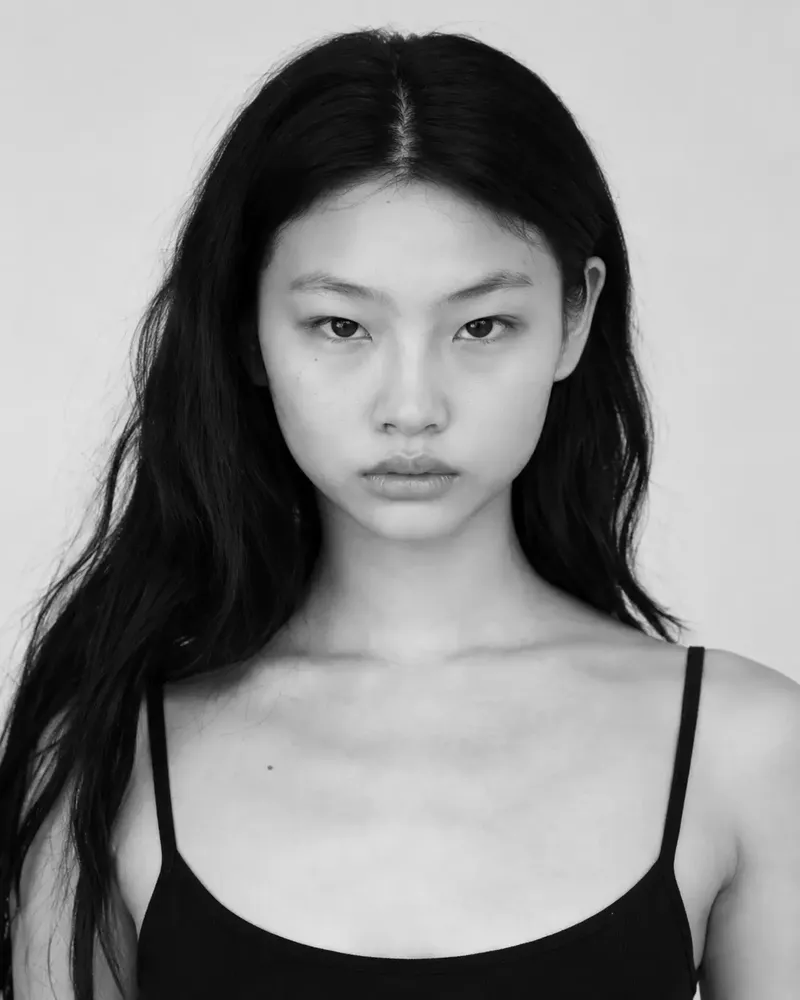 Three black and white photos of a model in a black dress (full length, close-up and half length), like the photos an agency asks to see